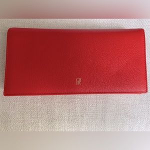 Carolina Herrera red wallet . Brand new . Good condition . Tags still on